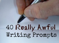 Hand with pen writing the words 40 Really Awful Writing Prompts